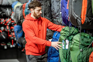 A man shops for camping gear.