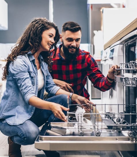 A couple shopping for a dish washer A couple shopping for a dish washer