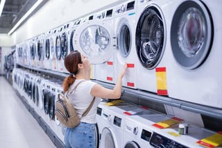 A woman shops for a new washer and dryer.