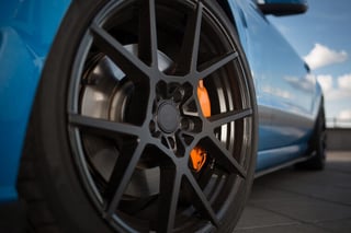 Black matte rims on a sports car.