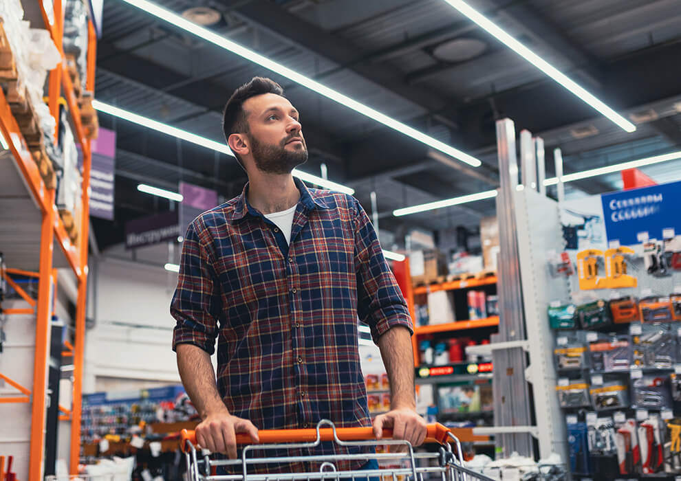 A man shops at a hardware store.