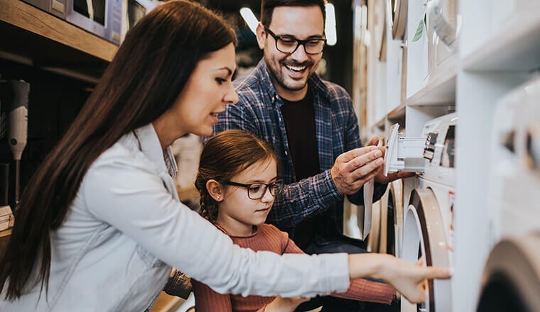 A family shopping for a washing machine.