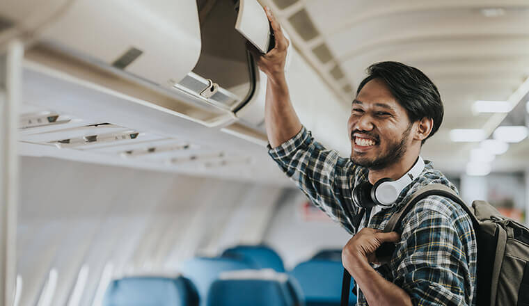 A young man prepares for a flight.